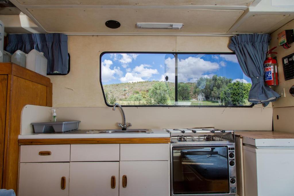 A kitchen or kitchenette at Breede River Houseboat Hire