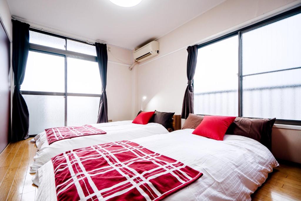 Un pat sau paturi într-o cameră la Murata Corpo 305