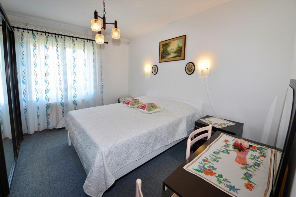 Postel nebo postele na pokoji v ubytování Apartment Complex Nevia