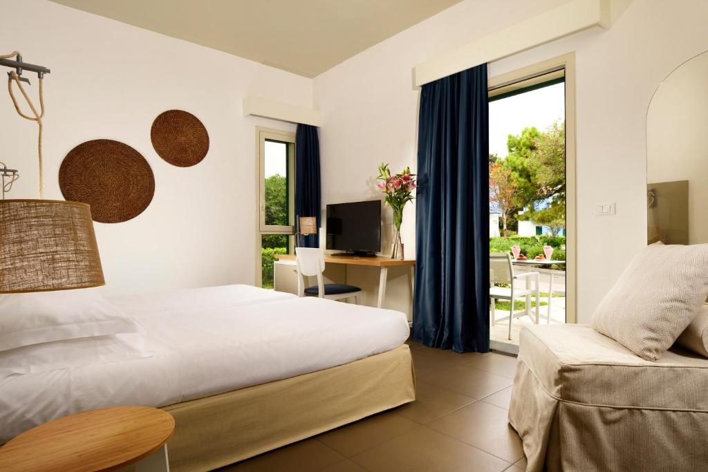 Postel nebo postele na pokoji v ubytování UNA HOTELS Naxos Beach Sicilia