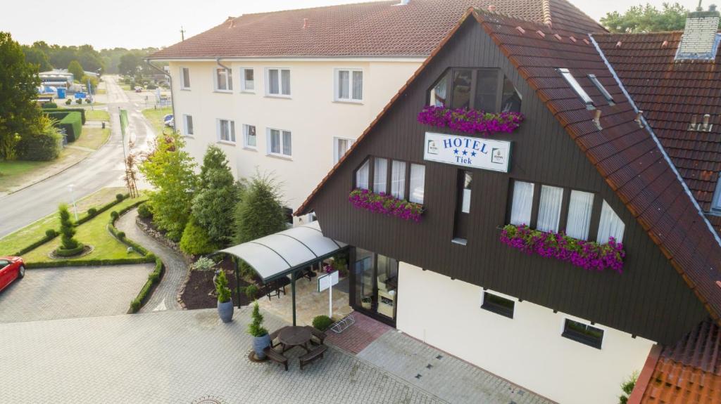 a building with a sign on the side of it at Hotel Tiek Superior in Meppen