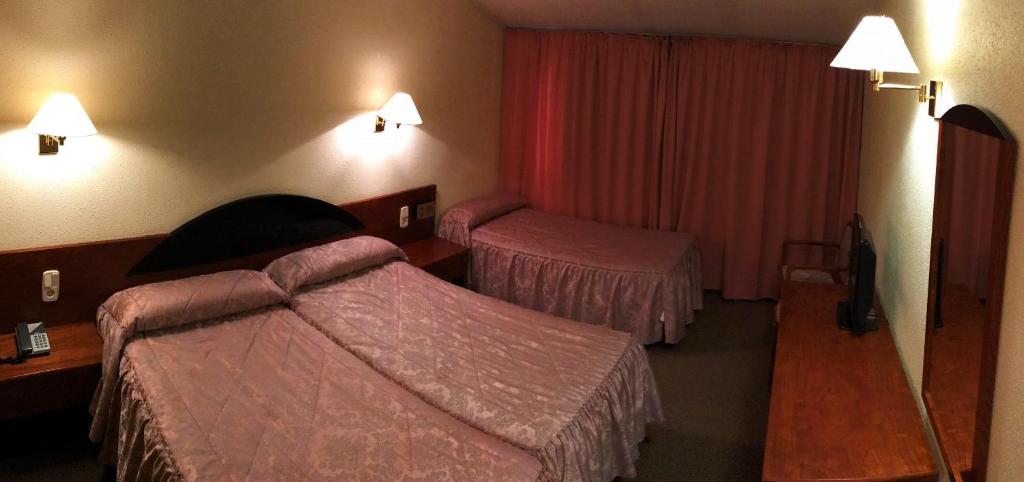 Postel nebo postele na pokoji v ubytování Hotel Roc Del Castell