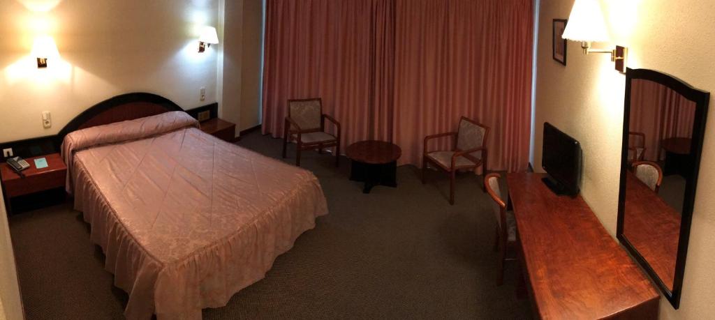 Postel nebo postele na pokoji v ubytování Hotel Roc Del Castell
