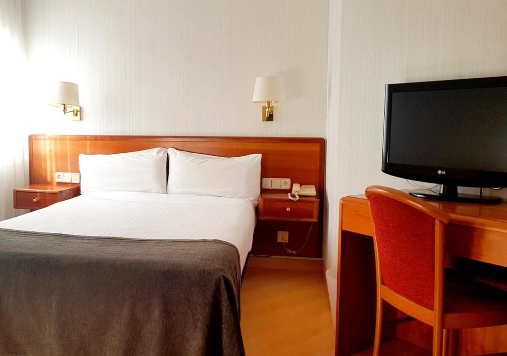 Postel nebo postele na pokoji v ubytování Hotel Ultonia