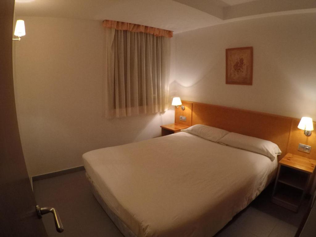 Postel nebo postele na pokoji v ubytování Apartamentos Turísticos Roc Del Castell