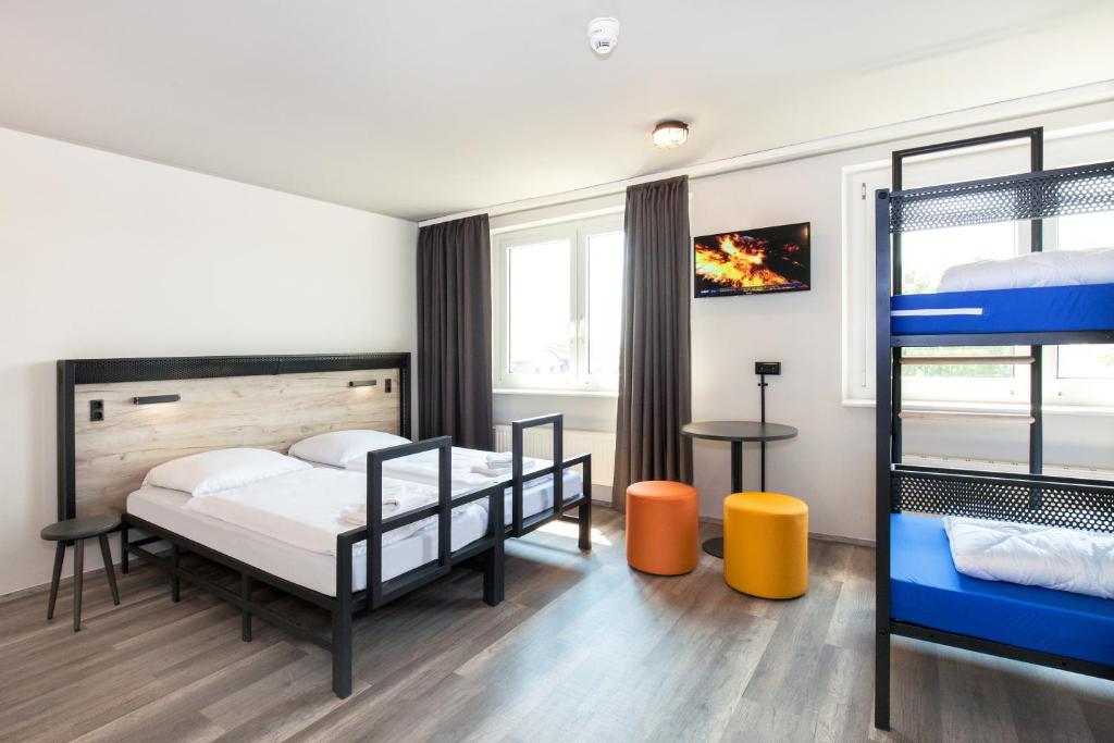 Postel nebo postele na pokoji v ubytování a&o Frankfurt Ostend