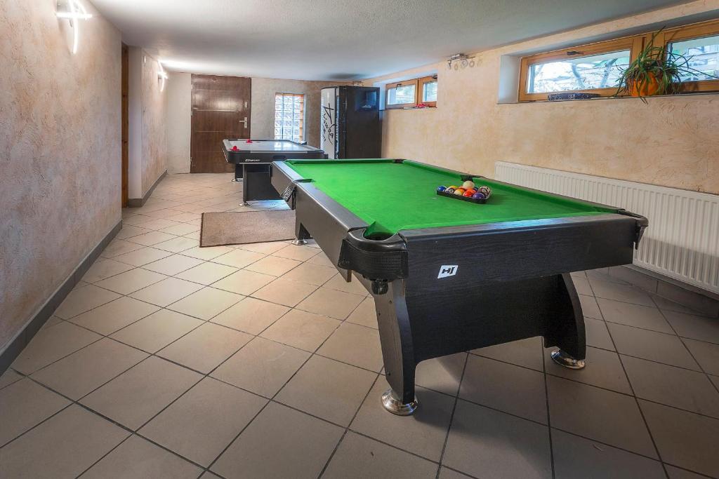 a billiard room with a pool table in it at Bastówka Apartamenty in Ustroń