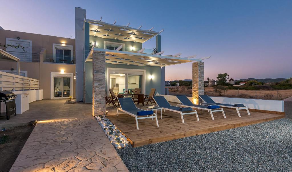 a house with a deck with chairs on it at Gennadi Villa Mary in Gennadi