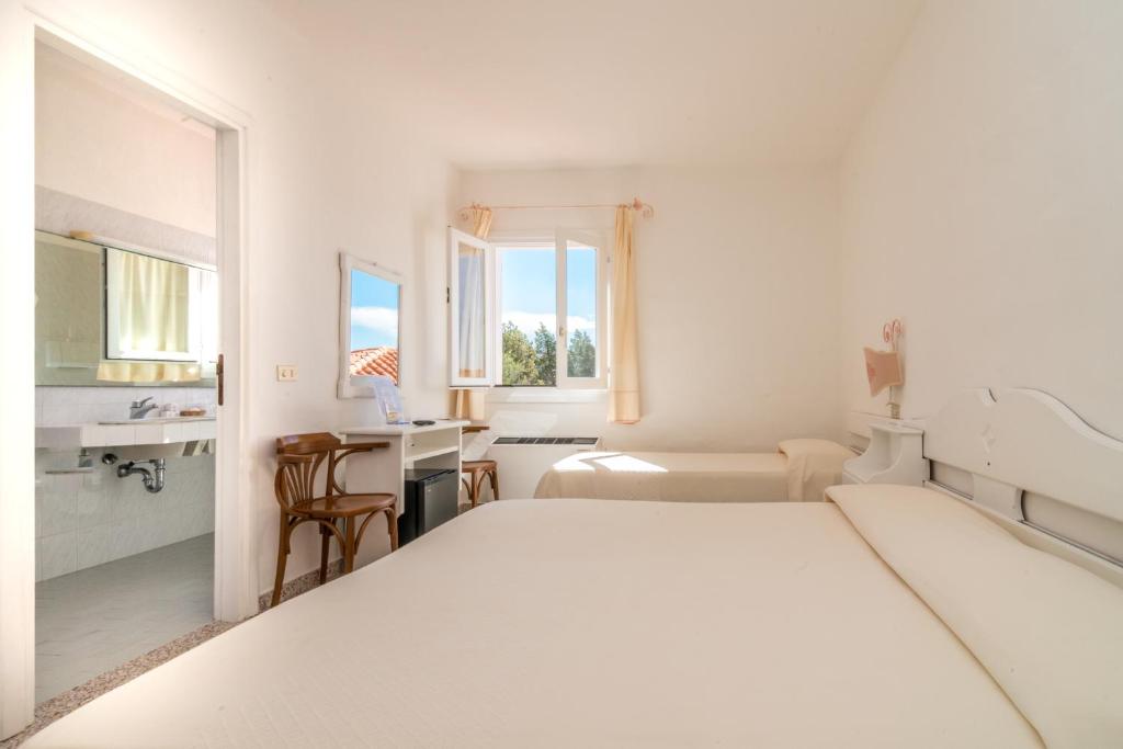 Postel nebo postele na pokoji v ubytování Hotel 3 Botti