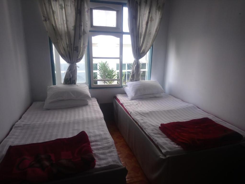 Postel nebo postele na pokoji v ubytování Diamond Star Guest House