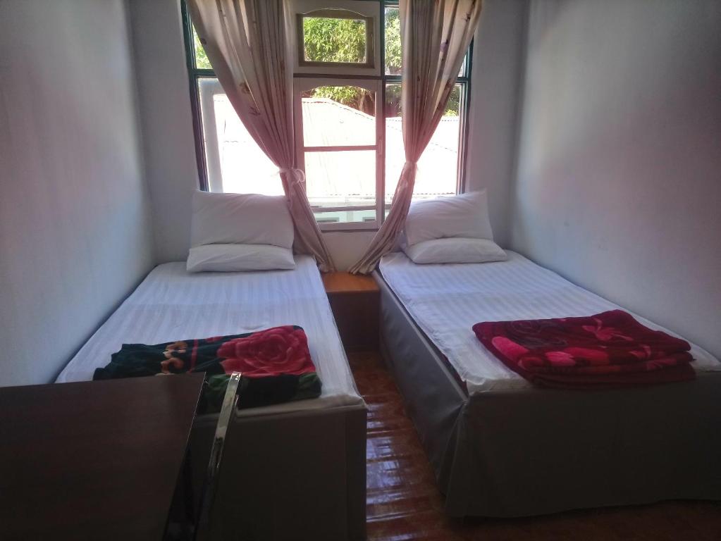 Postel nebo postele na pokoji v ubytování Diamond Star Guest House