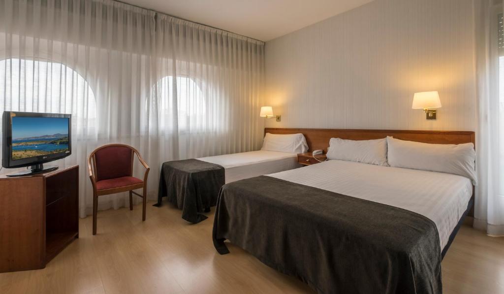 Postel nebo postele na pokoji v ubytování Hotel Ultonia