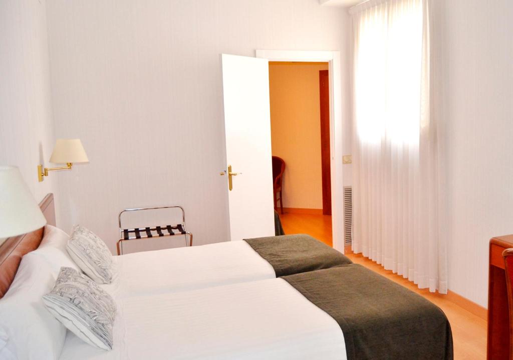 Postel nebo postele na pokoji v ubytování Hotel Ultonia