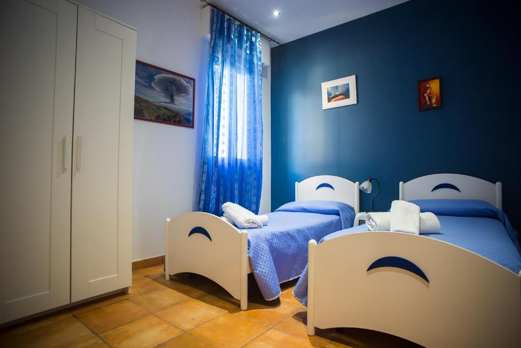 Postel nebo postele na pokoji v ubytování House Etna View