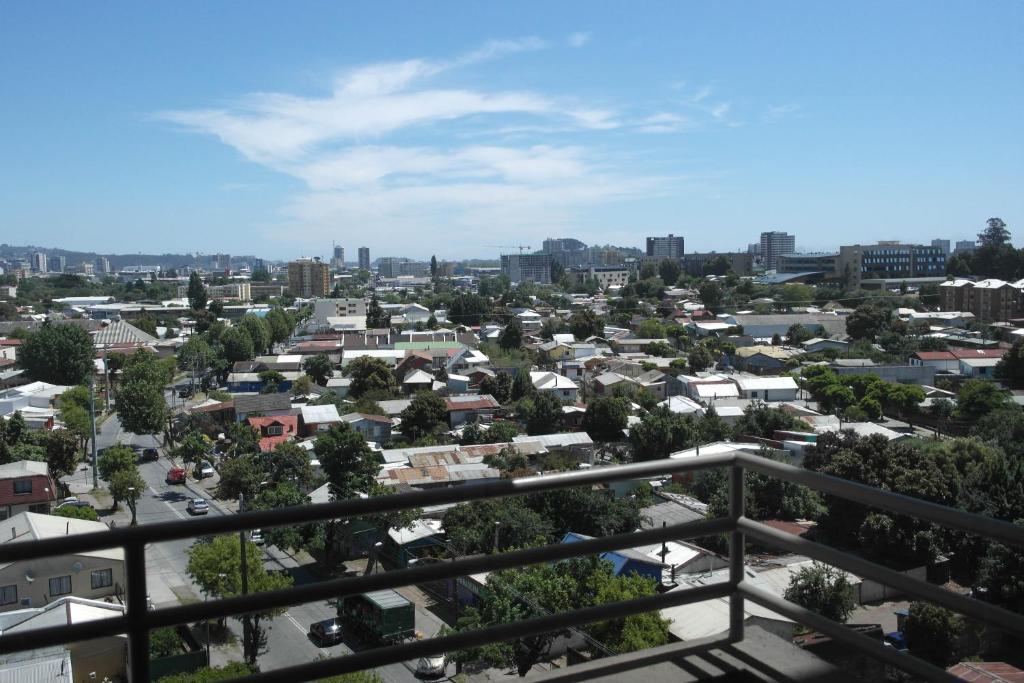 a view of a city from a balcony at Departamento Mirador Camilo Henriquez in Concepción