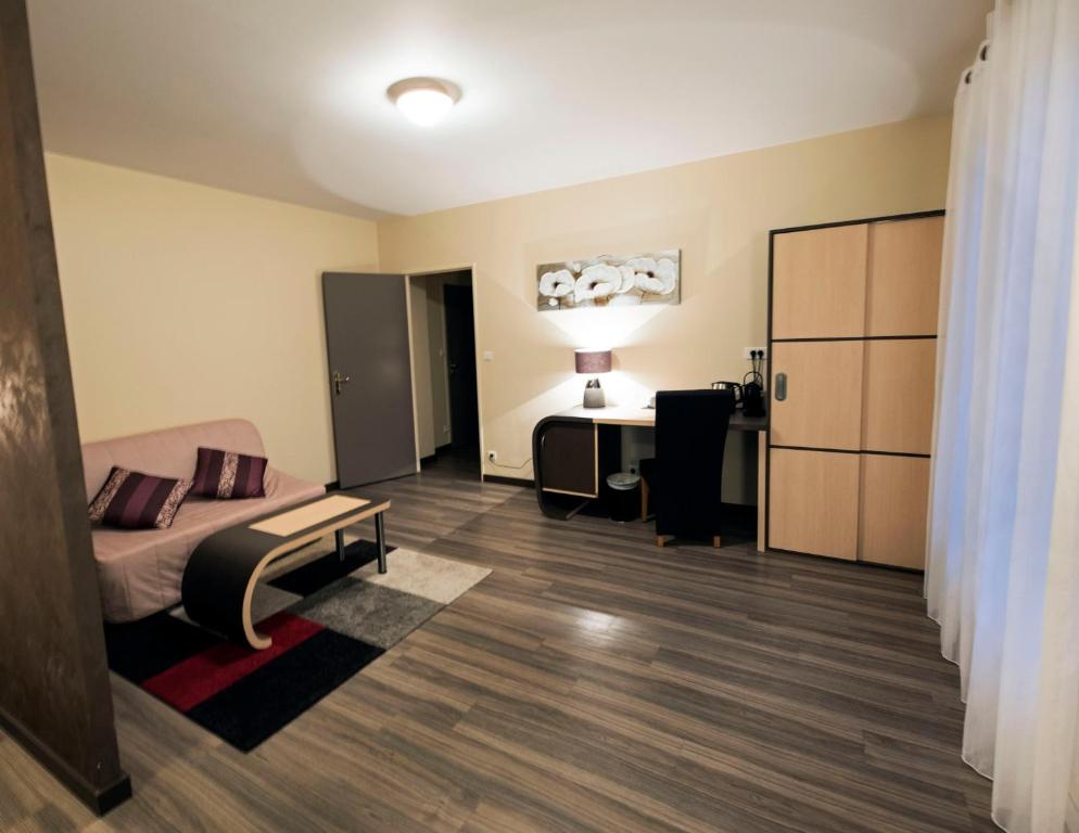 Postel nebo postele na pokoji v ubytování Hôtel Pédagogique Coeur d'Apcher