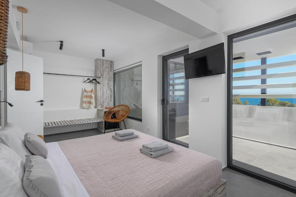 Posteľ alebo postele v izbe v ubytovaní Albatross Beach Front Villas
