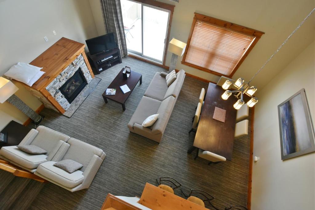 an aerial view of a living room with a fireplace at The Blue Escape Blue Mountain Chalet in Blue Mountains
