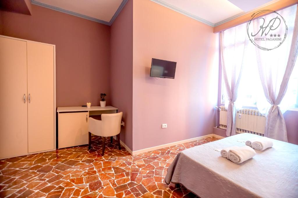 Posteľ alebo postele v izbe v ubytovaní Hotel Paganini