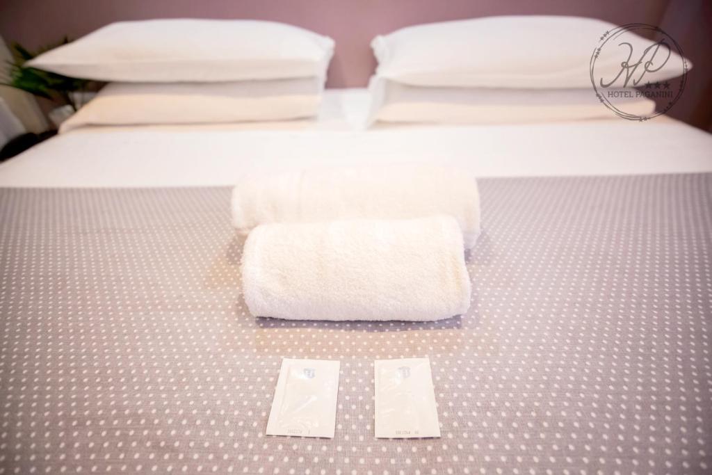 Posteľ alebo postele v izbe v ubytovaní Hotel Paganini