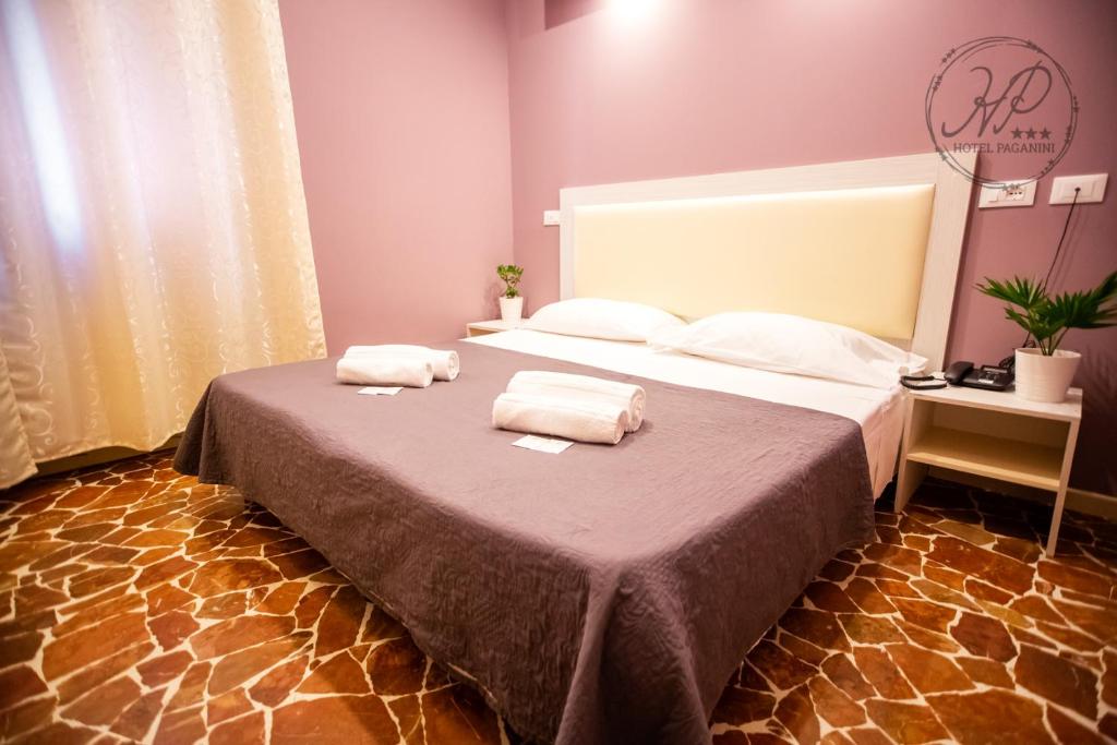 Posteľ alebo postele v izbe v ubytovaní Hotel Paganini