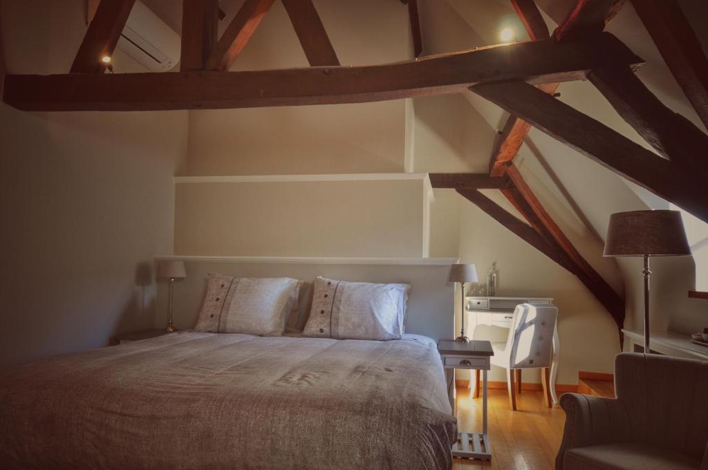 Postel nebo postele na pokoji v ubytování B&B Stillant