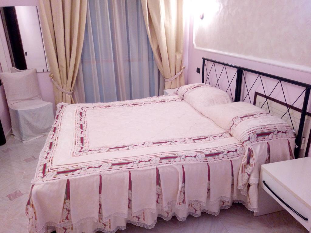 Postel nebo postele na pokoji v ubytování HOTEL AL QUERCETO