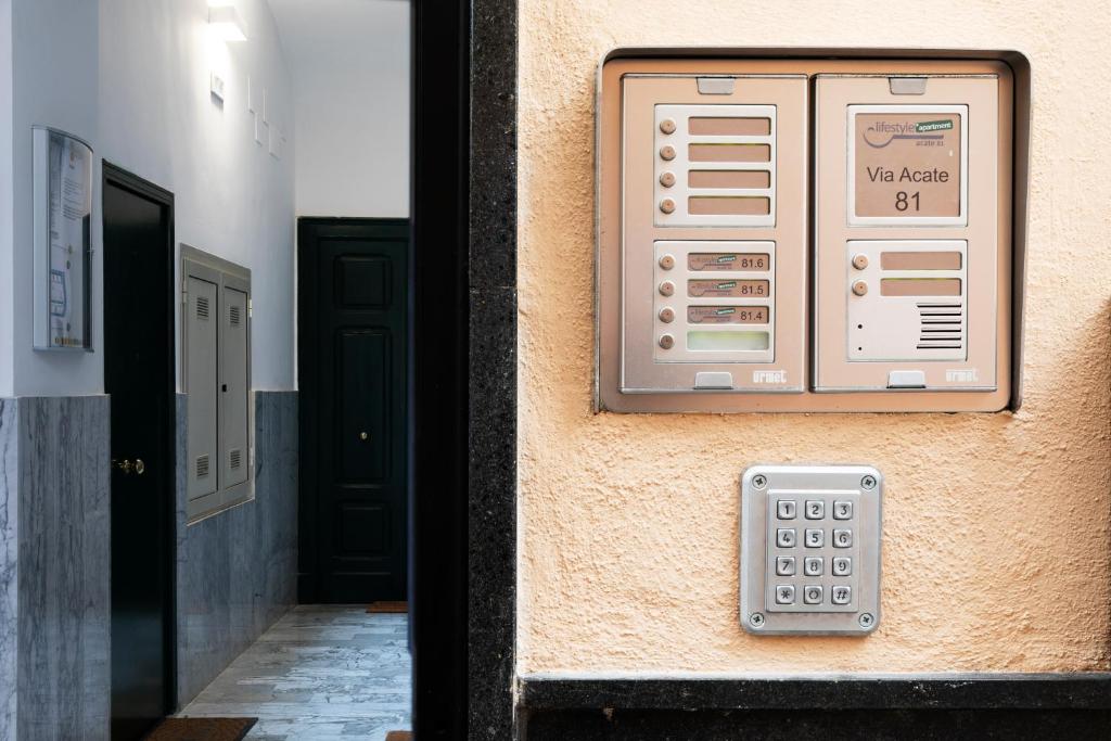 a pay phone on the side of a building at Acate81 Lifestyle Apartment in Naples