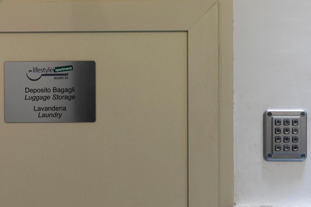 a close up of a door with a sign on it at Acate81 Lifestyle Apartment in Naples
