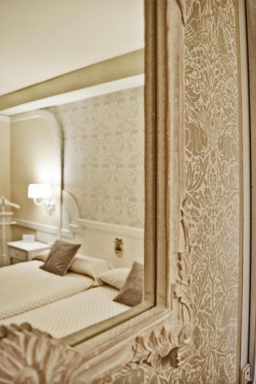 Postel nebo postele na pokoji v ubytování Hotel Maria Luisa
