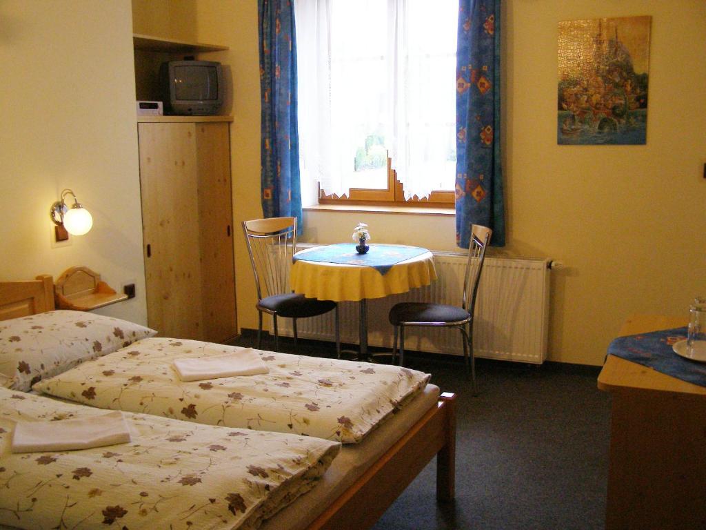 Postel nebo postele na pokoji v ubytování Apartmány Florian