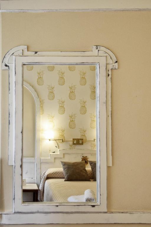 Postel nebo postele na pokoji v ubytování Hotel Maria Luisa
