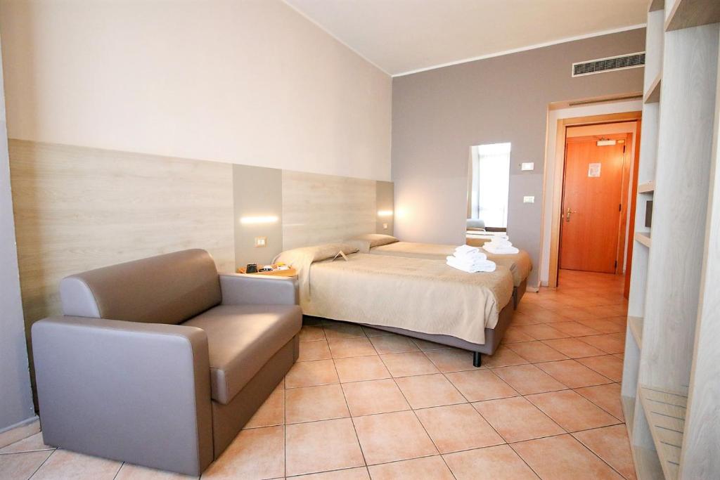 Postel nebo postele na pokoji v ubytování Hotel Miramonti