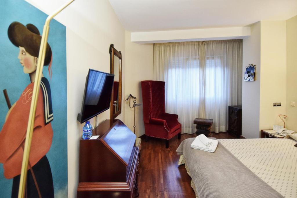 TV a/nebo společenská místnost v ubytování Hotel Maria Luisa