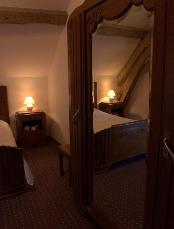 Postel nebo postele na pokoji v ubytování Le Clos de Châtres