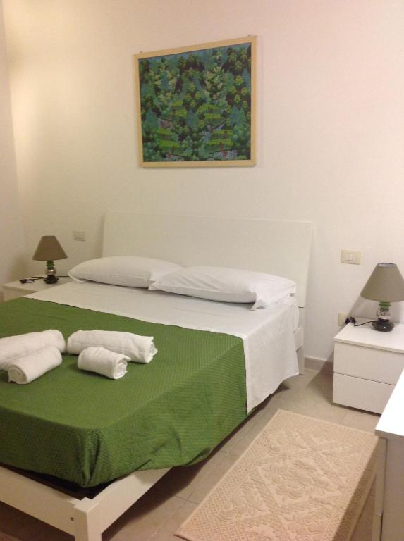 Posteľ alebo postele v izbe v ubytovaní Sole !! Cagliari centro