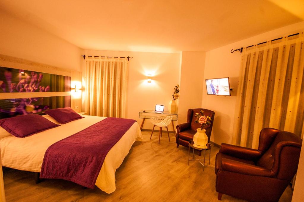 Postel nebo postele na pokoji v ubytování Hotel Hc Zoom