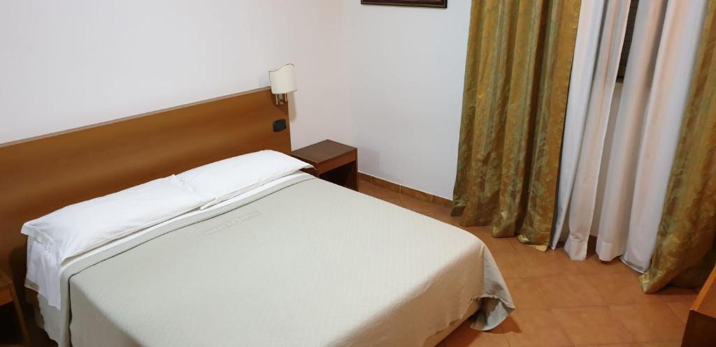 Postel nebo postele na pokoji v ubytování Grand Hotel Pavone