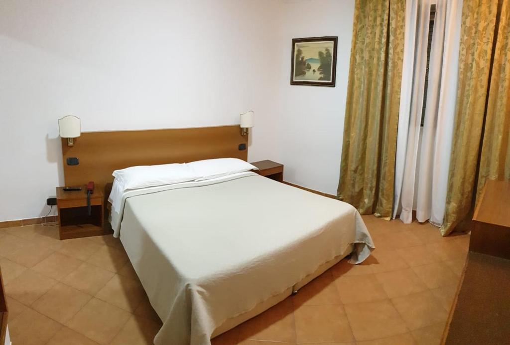 Postel nebo postele na pokoji v ubytování Grand Hotel Pavone