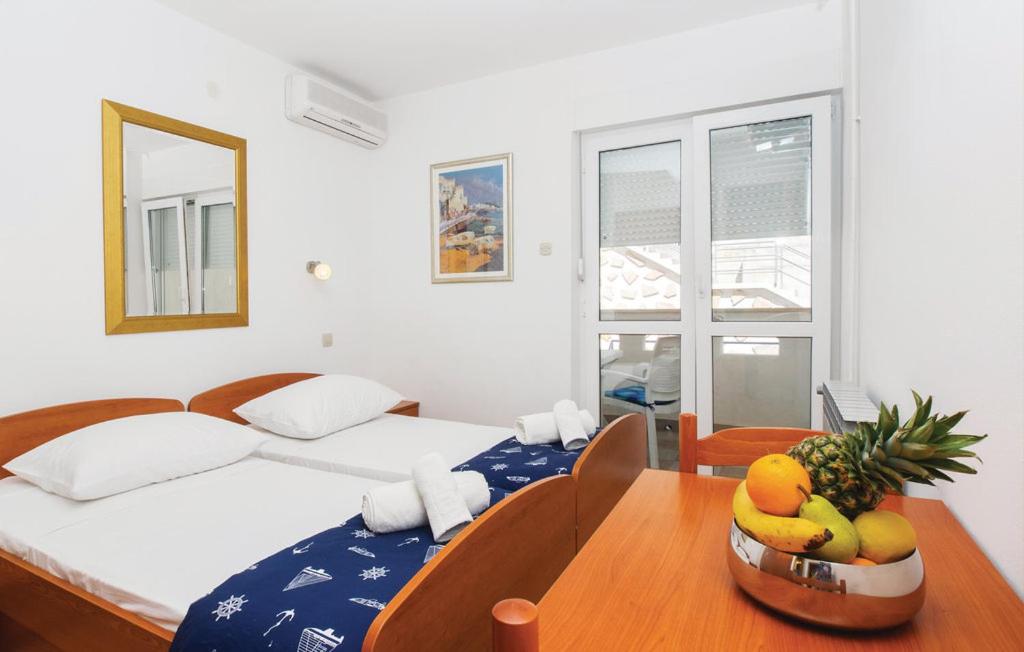 Posteľ alebo postele v izbe v ubytovaní Sunrise Apartments and Studio Apartments