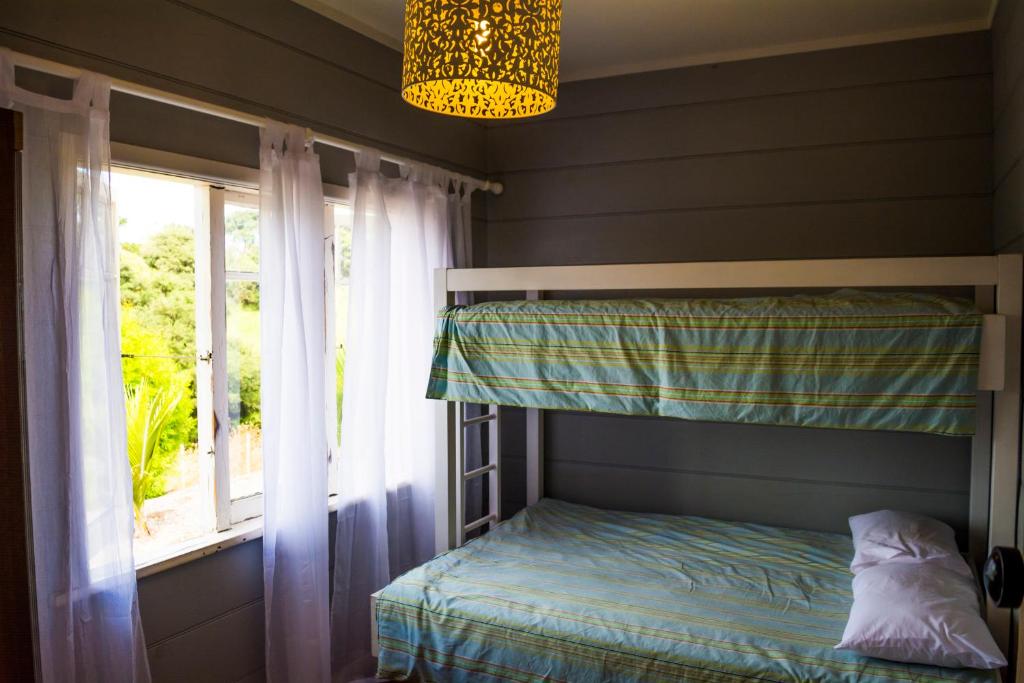 Postel nebo postele na pokoji v ubytování Freshwaterfarm Cottages - Muriwai