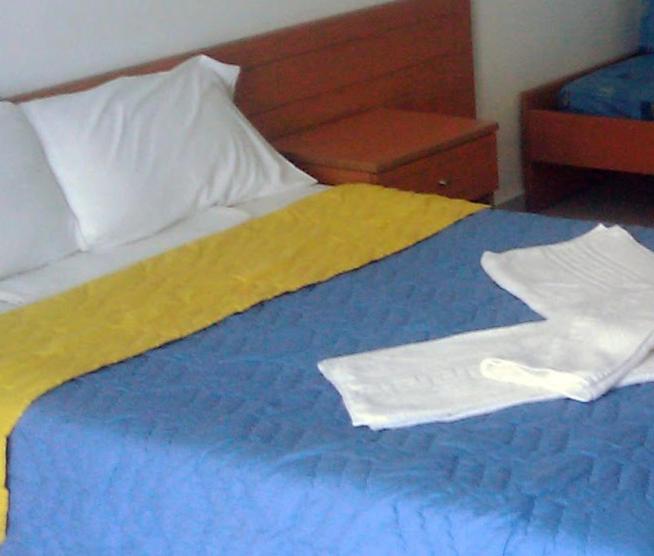 Postel nebo postele na pokoji v ubytování Eleni Palace