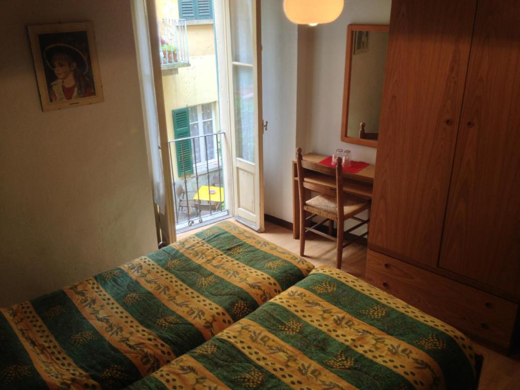 Postel nebo postele na pokoji v ubytování Albergo Il Vapore