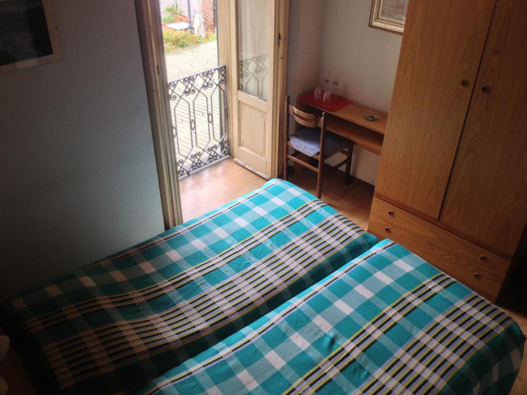 Postel nebo postele na pokoji v ubytování Albergo Il Vapore