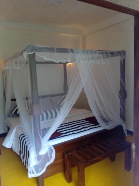 Postel nebo postele na pokoji v ubytování Forest Paddy Homestay