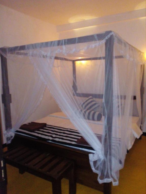 Postel nebo postele na pokoji v ubytování Forest Paddy Homestay