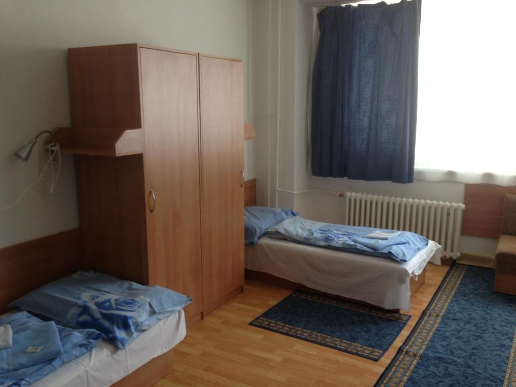 Postel nebo postele na pokoji v ubytování Hotel Prim