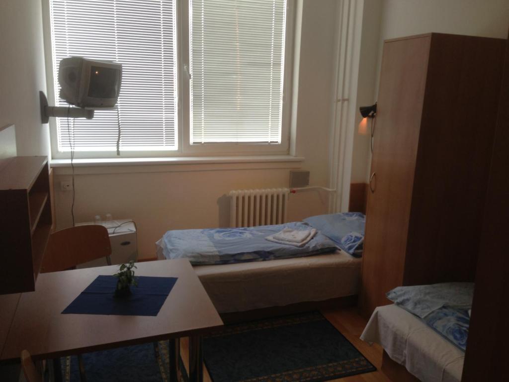 Postel nebo postele na pokoji v ubytování Hotel Prim