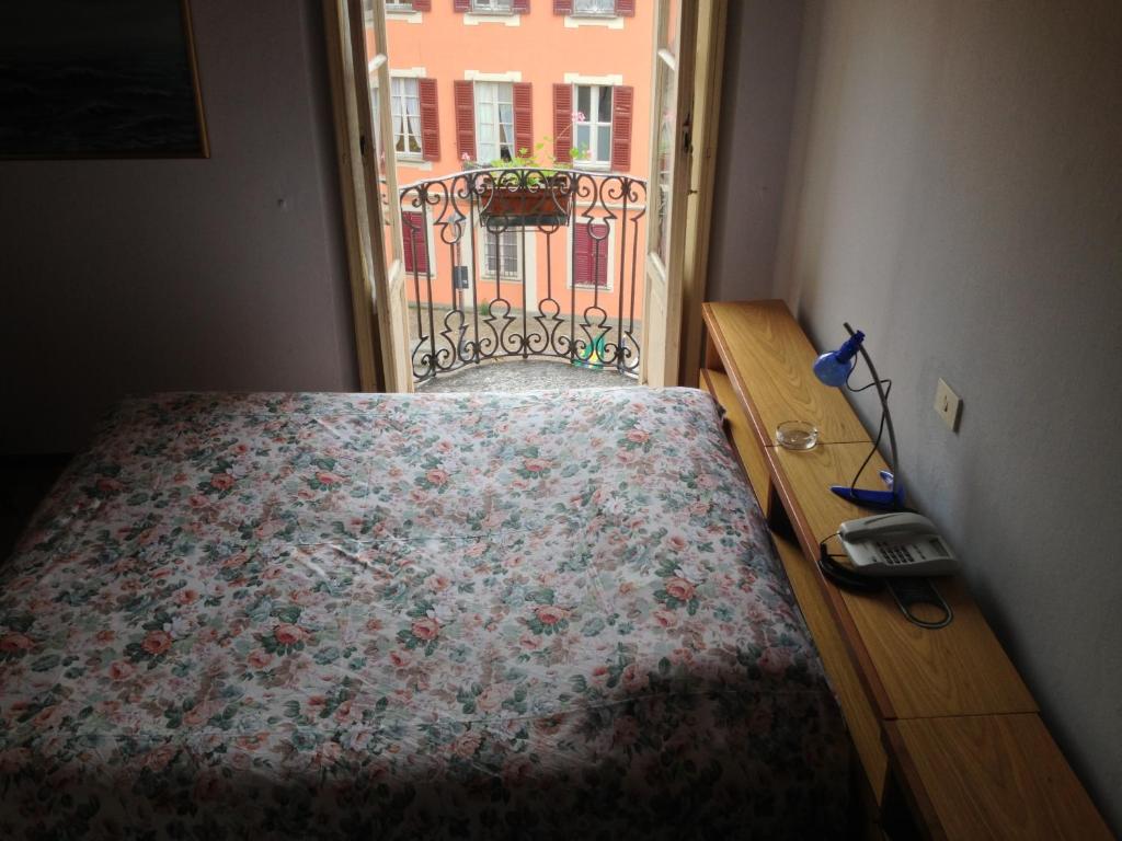 Postel nebo postele na pokoji v ubytování Albergo Il Vapore