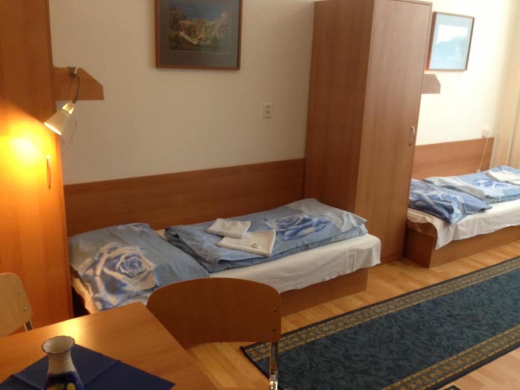 Postel nebo postele na pokoji v ubytování Hotel Prim
